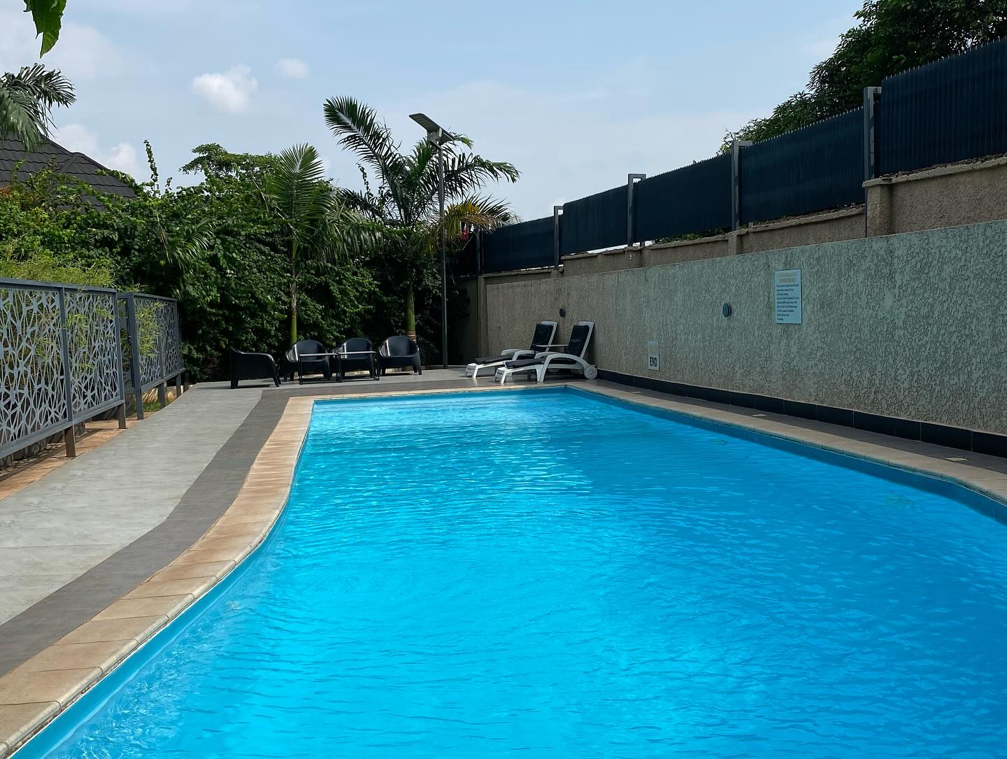 Outdoor swimming pool at Seven Lugard Apartments